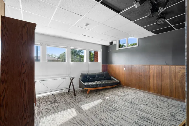 a living room with furniture and a rug