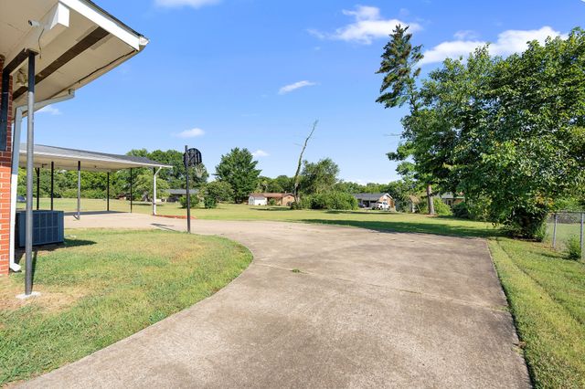 a view of yard with swimming pool