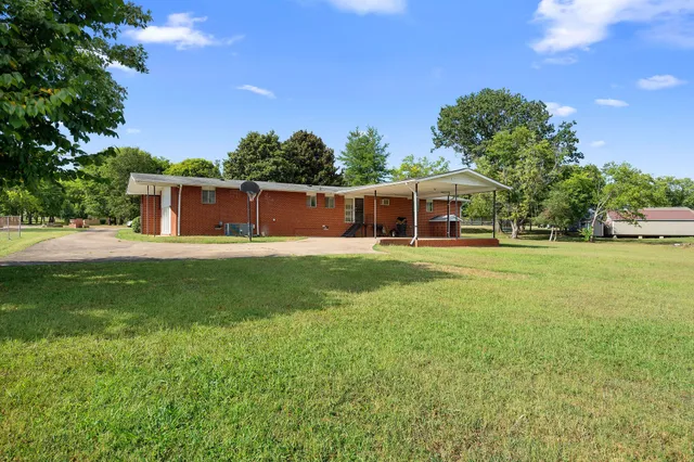 a view of a house with a big yard