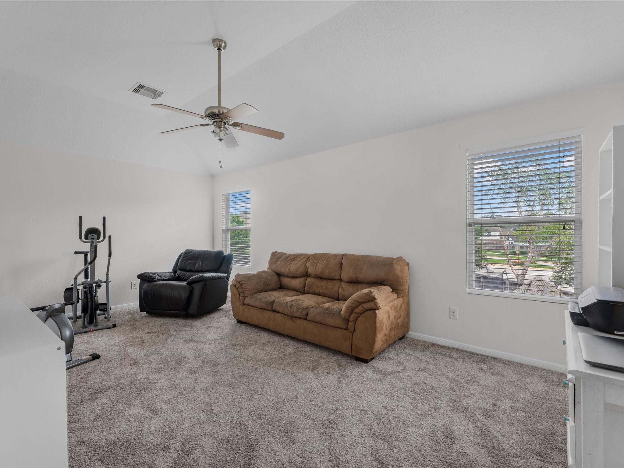 22422 Lamaster Lane Spring, TX 77373 - Photo 17 of 35 Upstairs spacious game room featuring neutral walls and a ceiling fan.