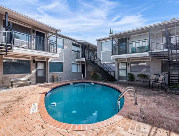 a view of a house with swimming pool