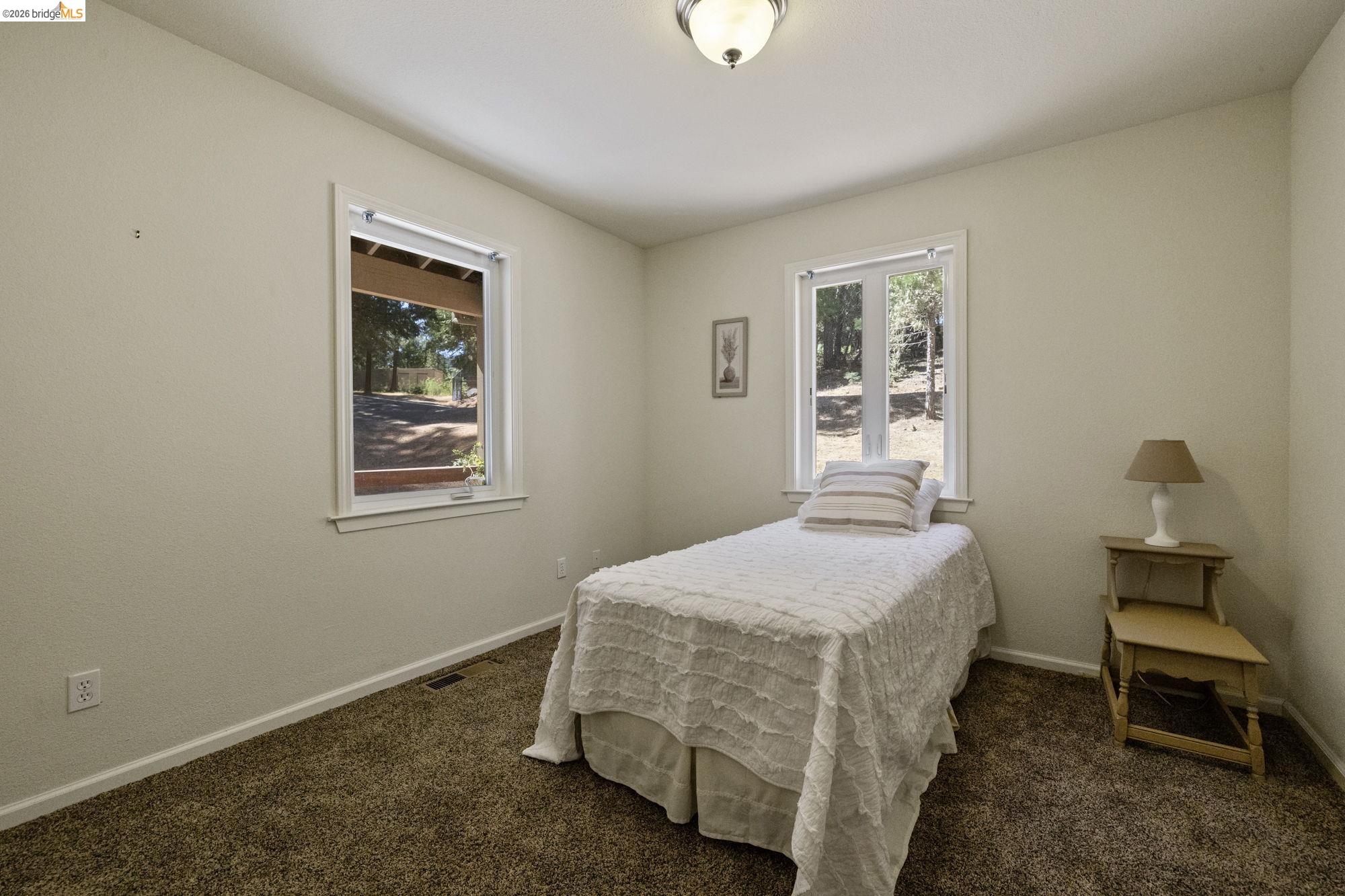 24669 Center Camp Road Twain Harte, CA 95383 - Photo 15 of 33 a bedroom with a bed and a window