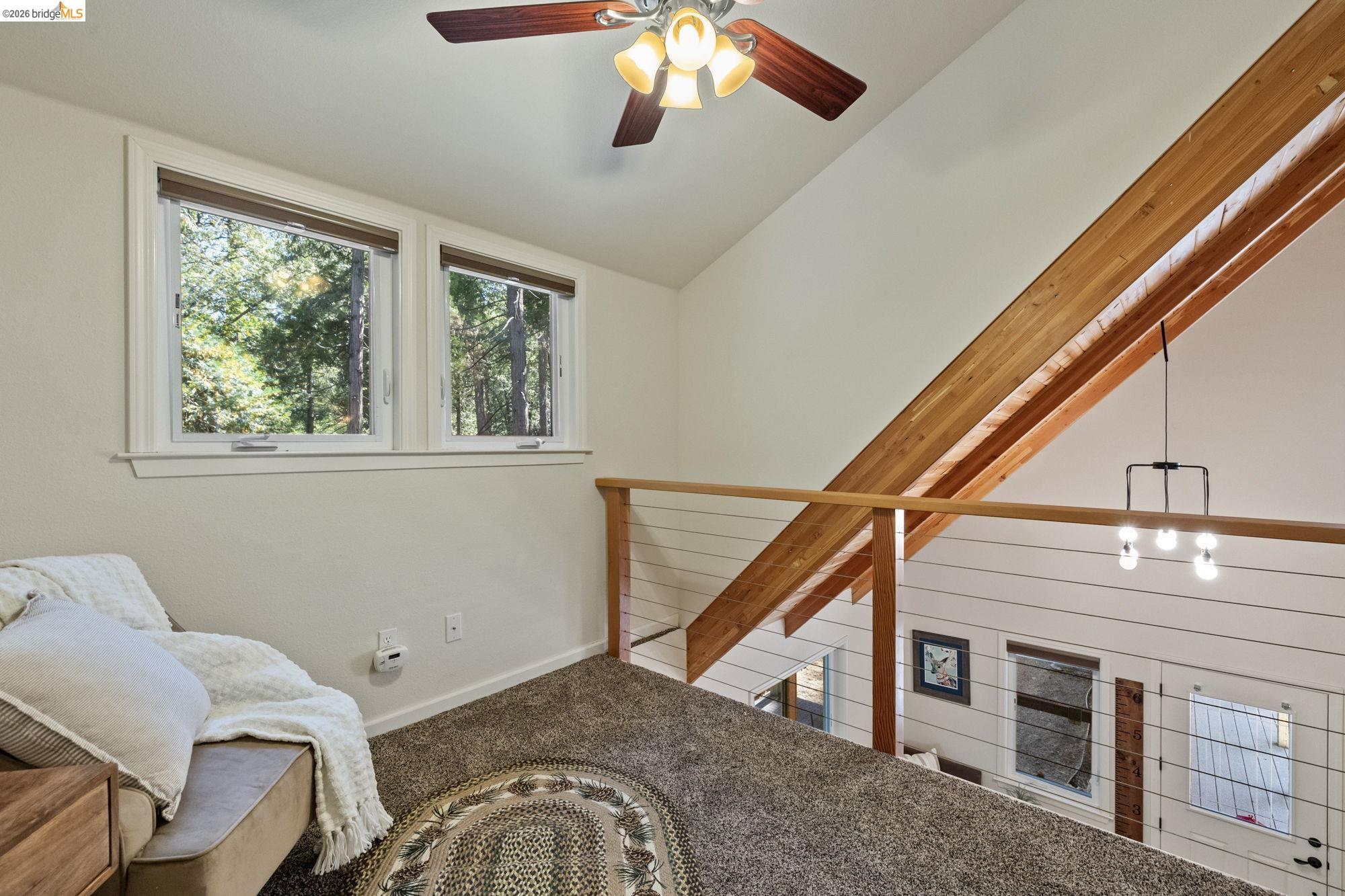 24669 Center Camp Road Twain Harte, CA 95383 - Photo 22 of 33 a view of a livingroom with furniture and staircase