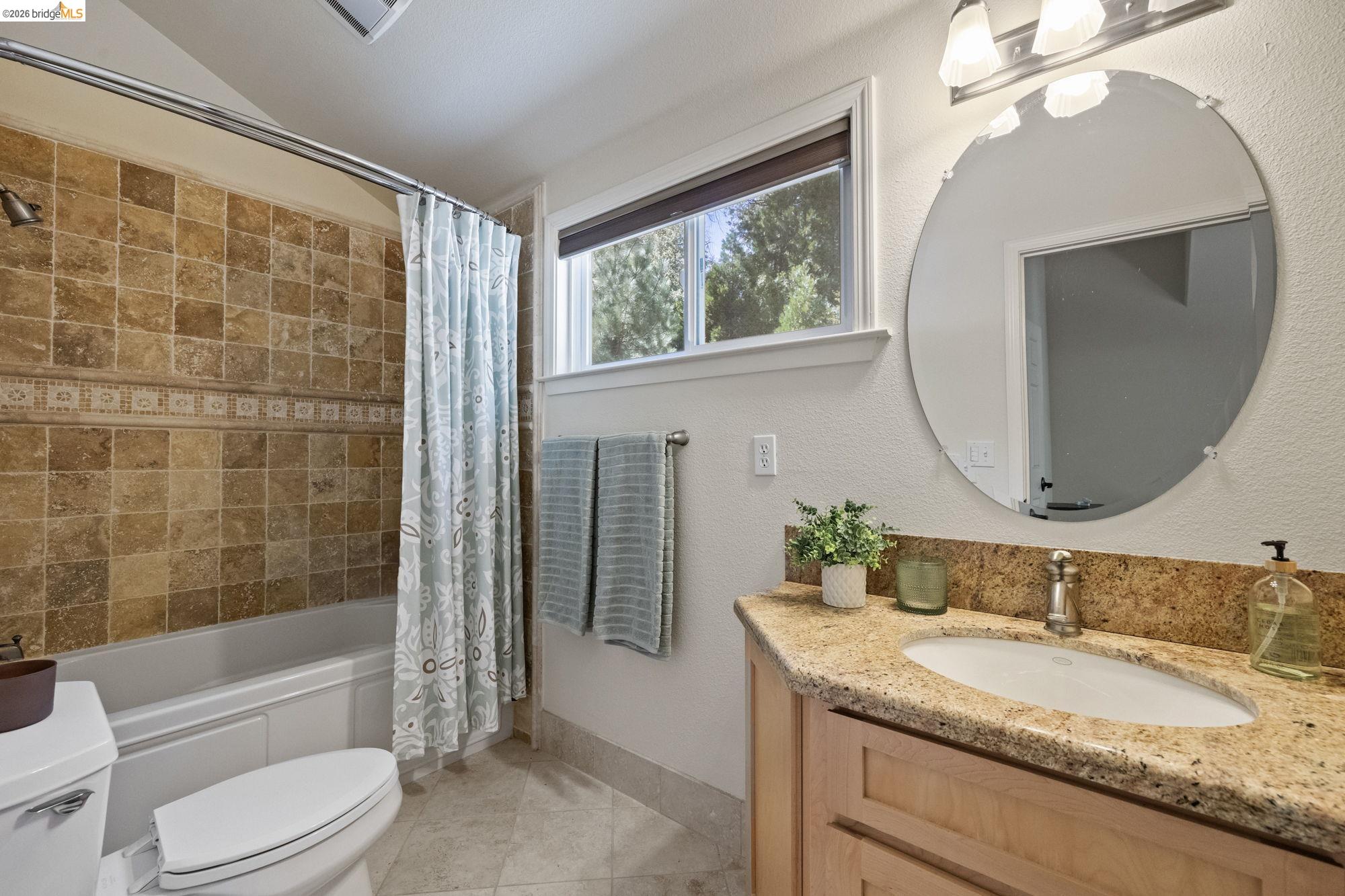 24669 Center Camp Road Twain Harte, CA 95383 - Photo 26 of 33 a bathroom with a granite countertop sink toilet mirror and bathtub