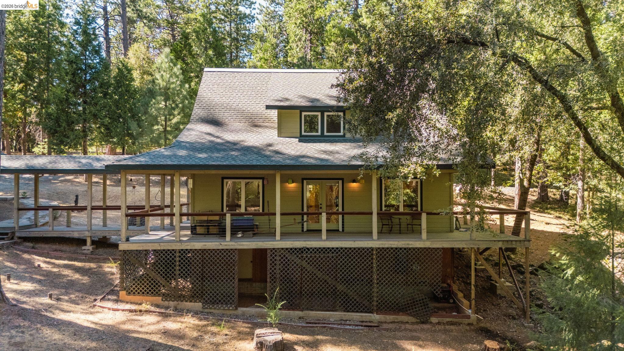 24669 Center Camp Road Twain Harte, CA 95383 - Photo 27 of 33 a front view of a house with a yard