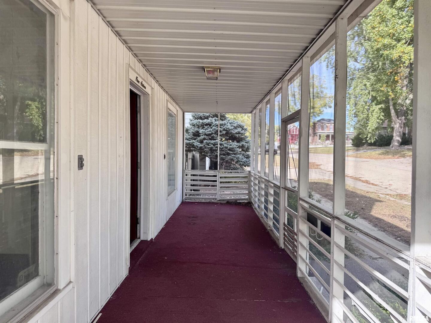 916 7th Street Fulton, IL 61252 - Photo 29 of 32 a view of a porch with wooden floor and stairs