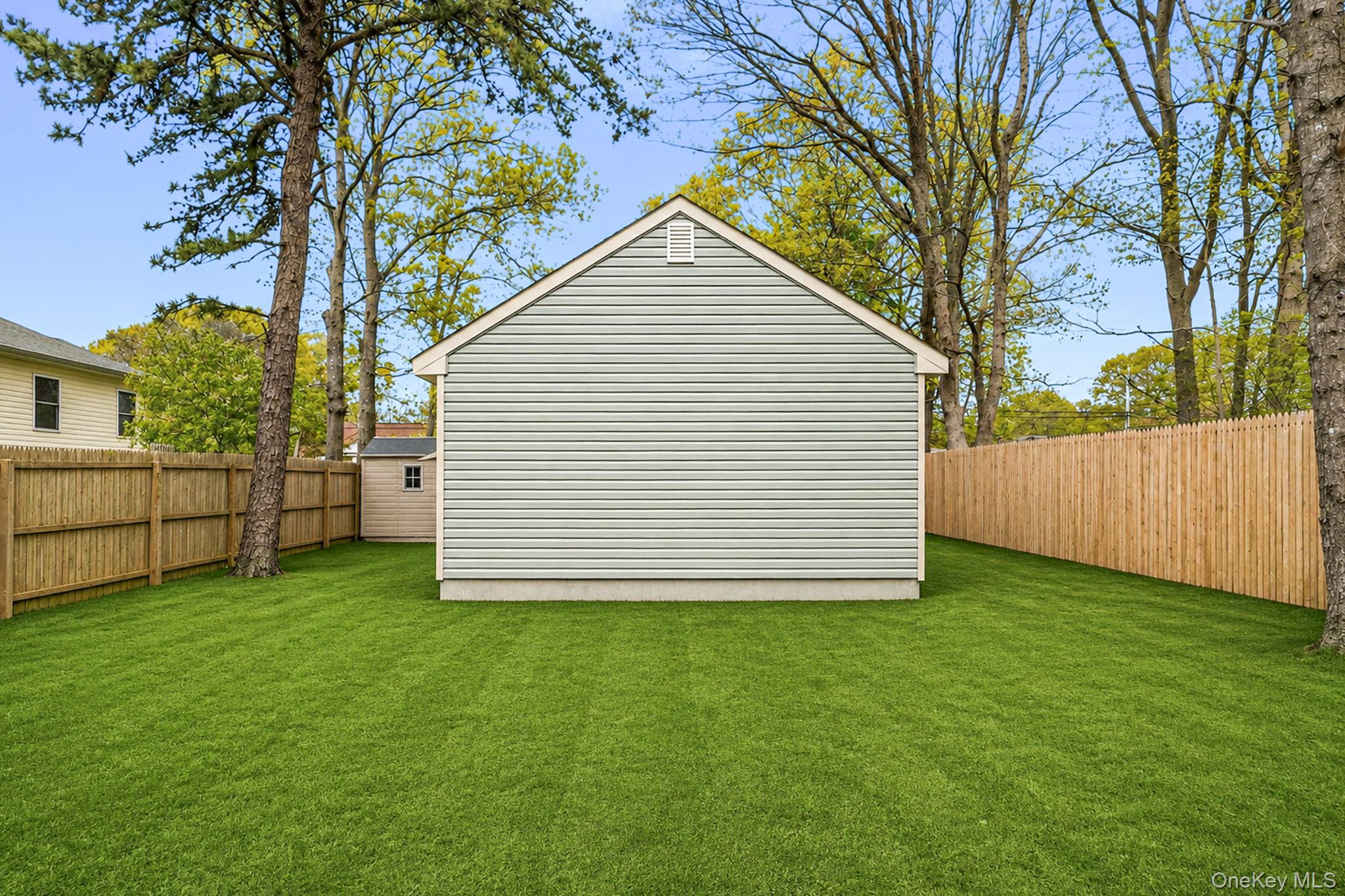332 Commack Road Shirley, NY 11967 - Photo 25 of 25 a view of a backyard with a garden