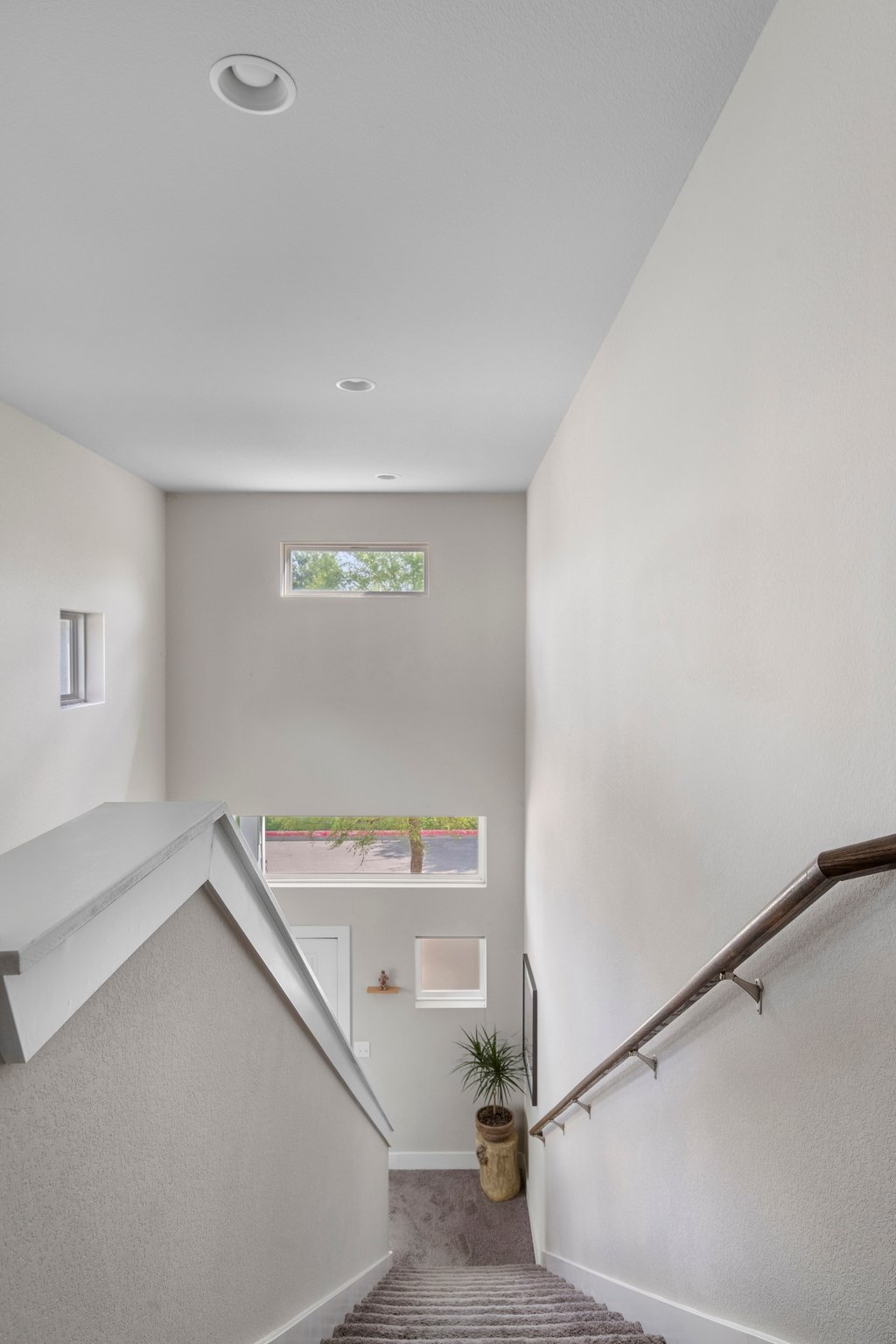 610 Bernstein Street, Unit 14 Austin, TX 78745 - Photo 32 of 39 Staircase with carpet floors and baseboards