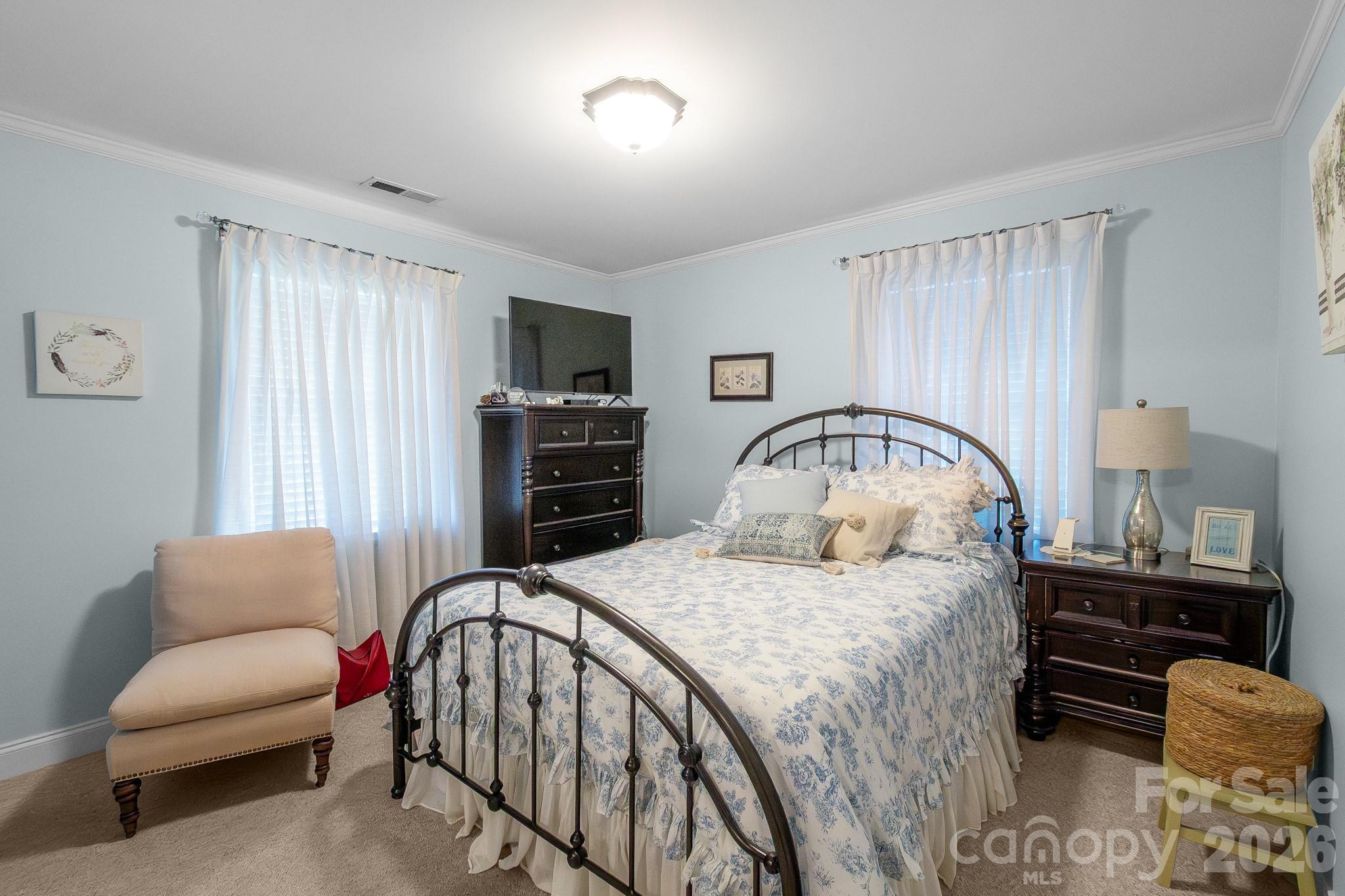 572 Acorn Acres Road Norwood, NC 28128 - Photo 11 of 39 a bedroom with a bed and a couch