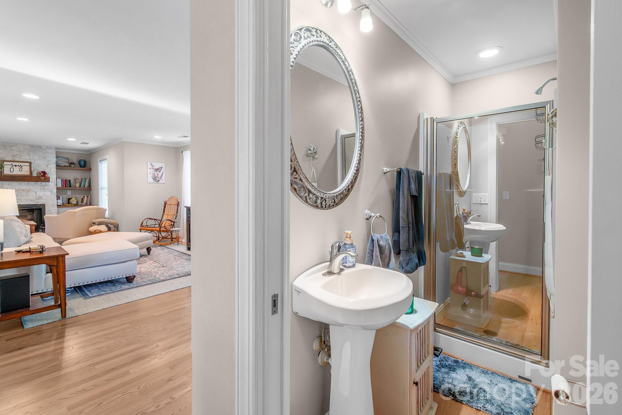 572 Acorn Acres Road Norwood, NC 28128 - Photo 12 of 39 a en suite bathroom with a sink and mirror