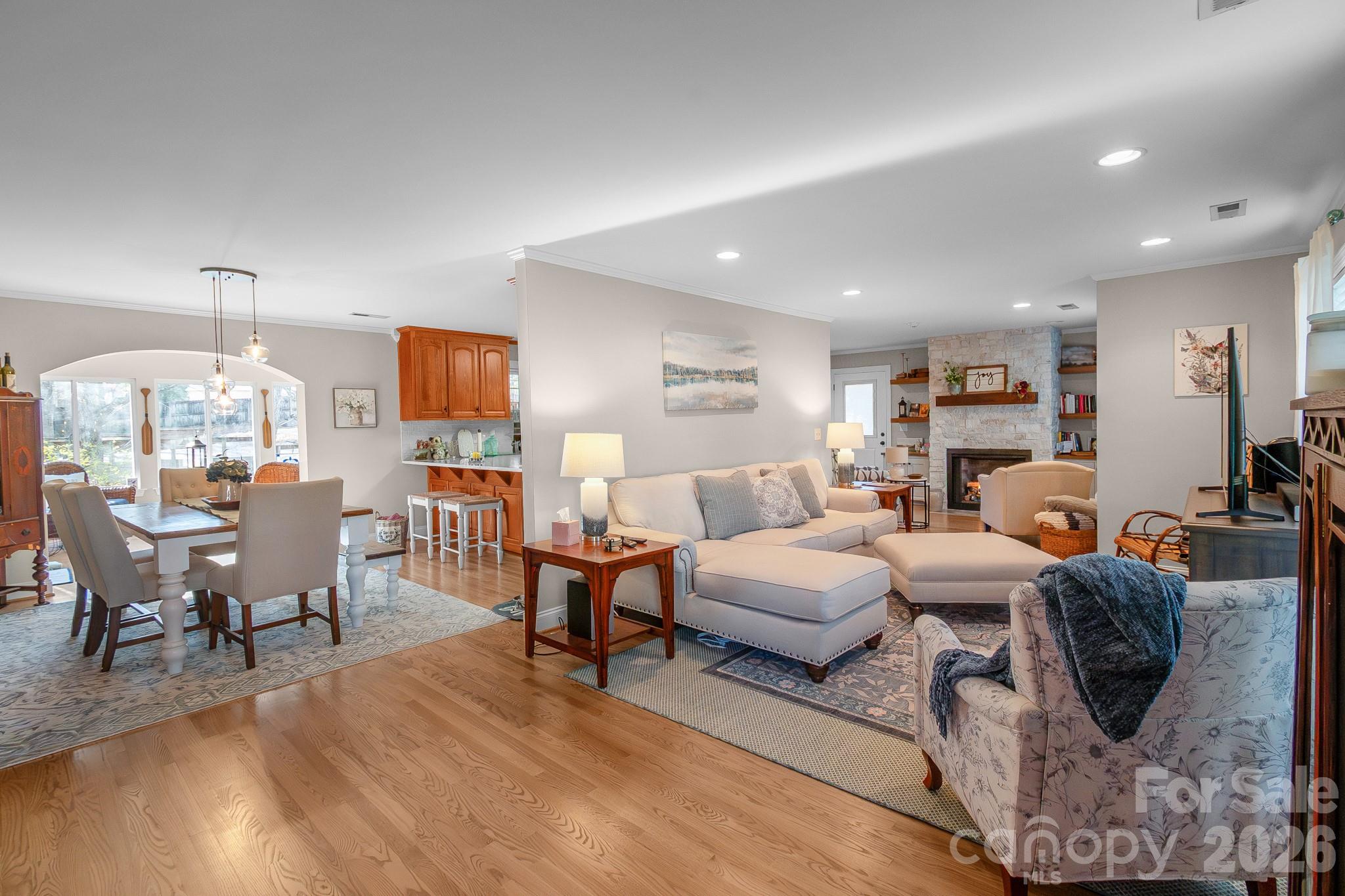 572 Acorn Acres Road Norwood, NC 28128 - Photo 14 of 39 a living room with furniture dining table and a large window