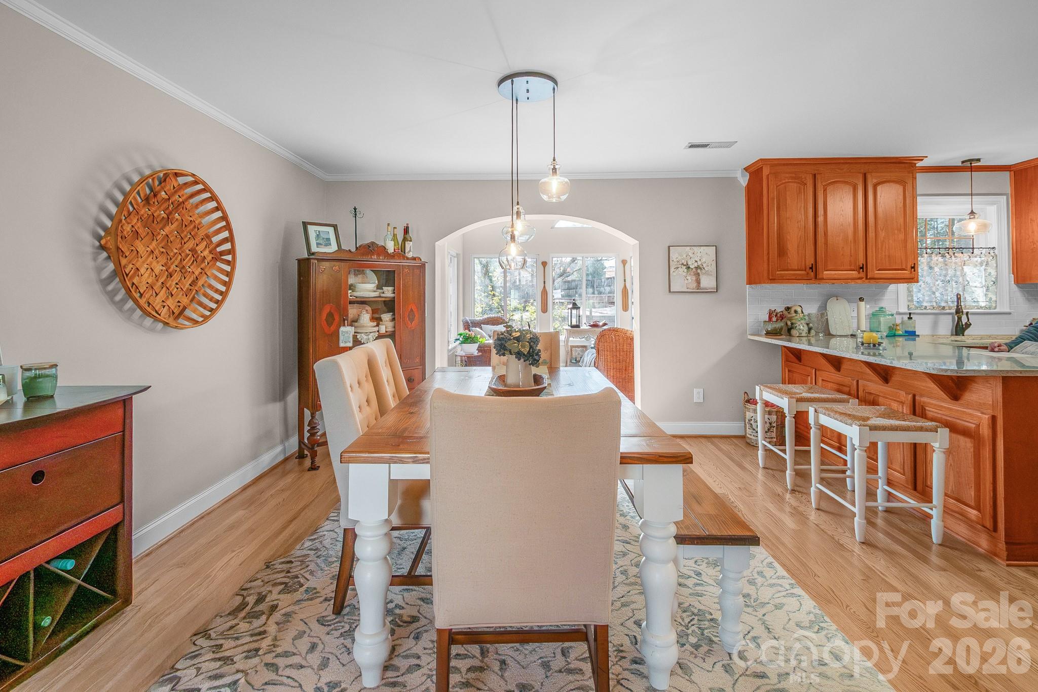 572 Acorn Acres Road Norwood, NC 28128 - Photo 15 of 39 a view of a dining room with furniture window and wooden floor