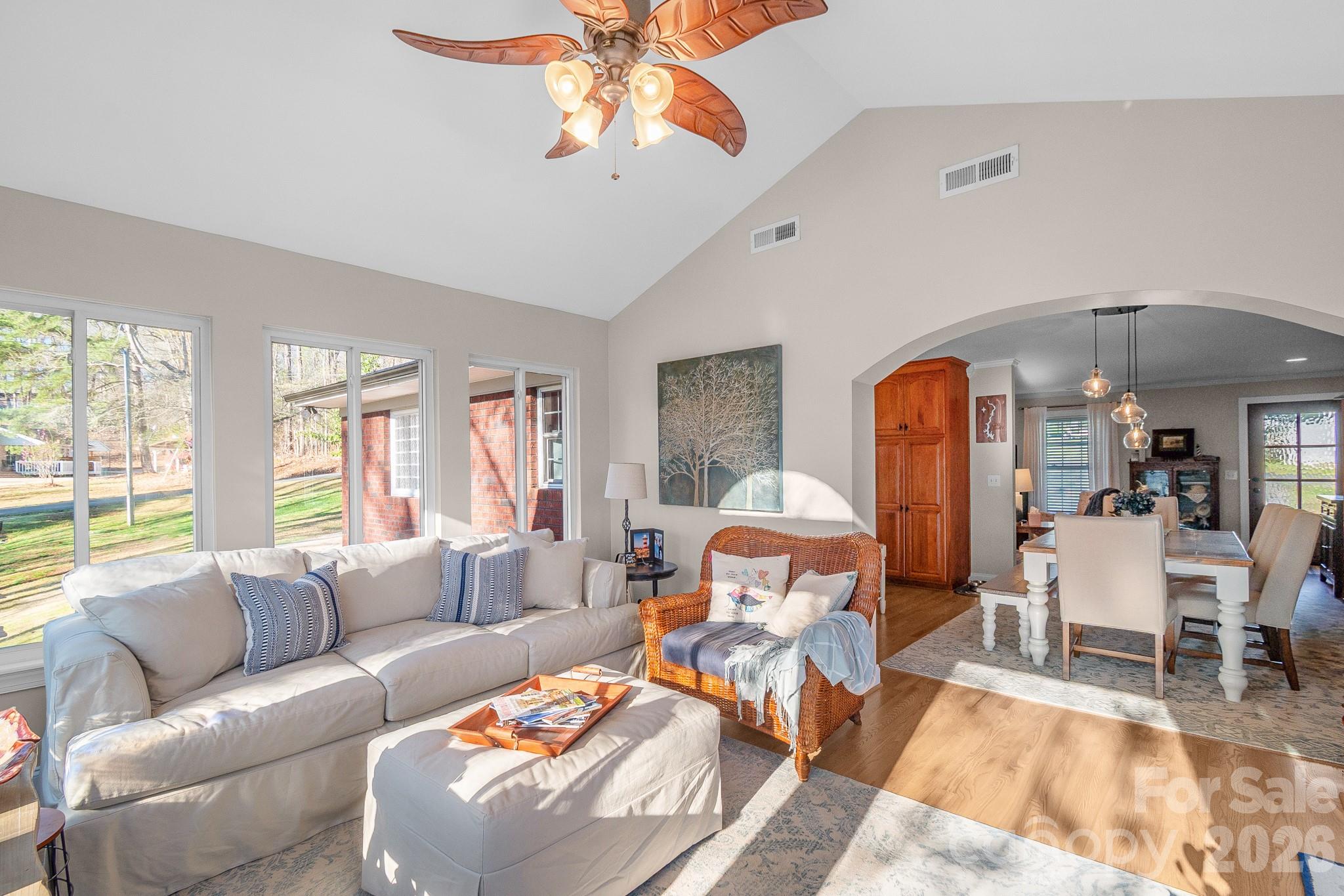572 Acorn Acres Road Norwood, NC 28128 - Photo 17 of 39 a living room with furniture a chandelier and a large window