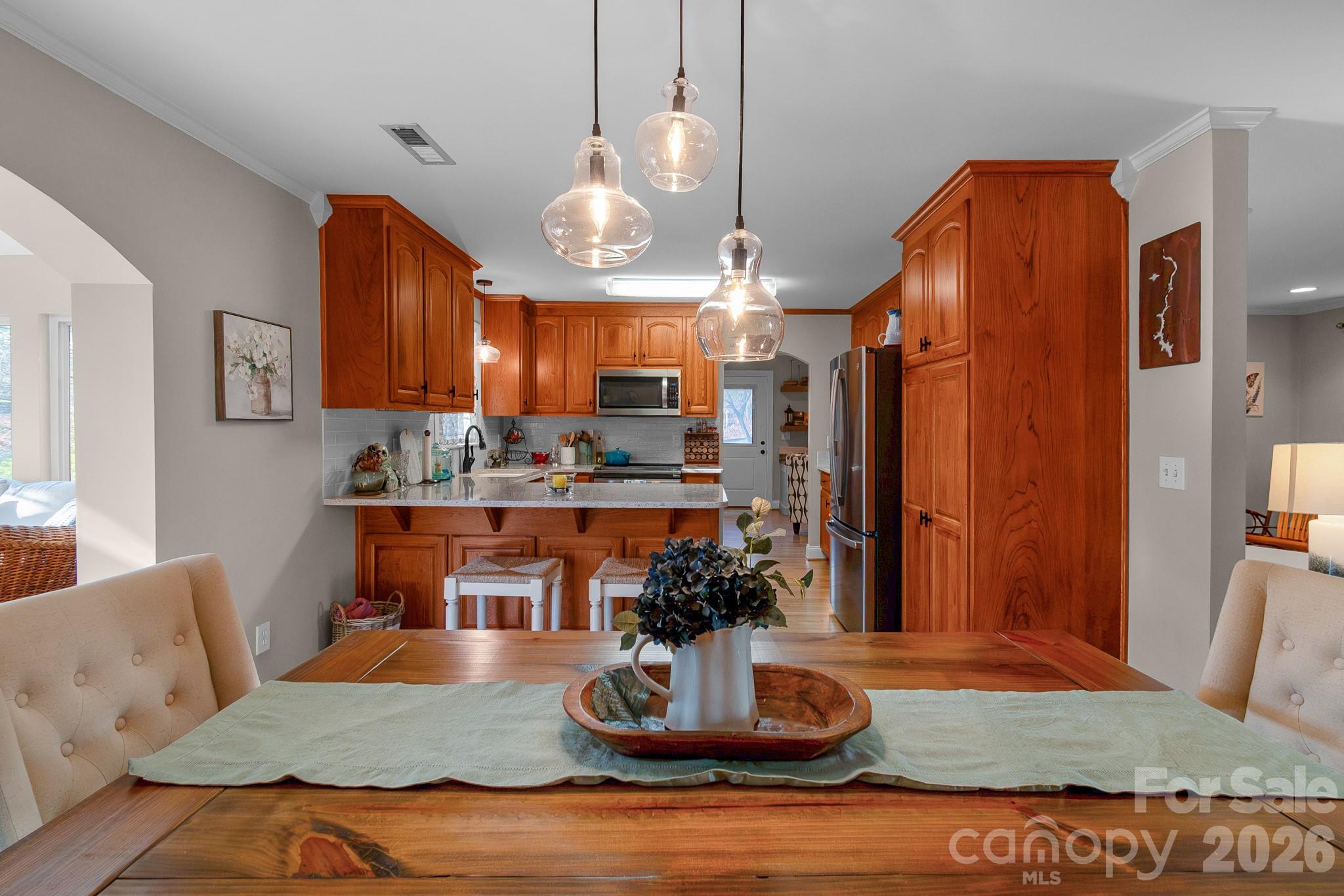 572 Acorn Acres Road Norwood, NC 28128 - Photo 21 of 39 a living room with stainless steel appliances kitchen island granite countertop furniture and a view of kitchen