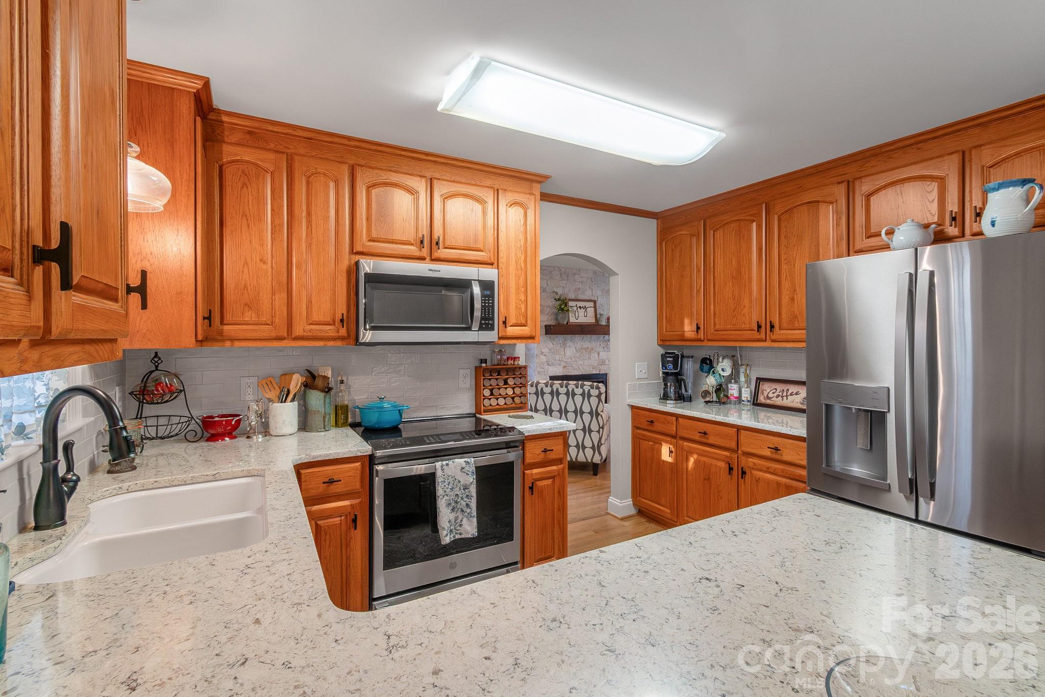 572 Acorn Acres Road Norwood, NC 28128 - Photo 26 of 39 a kitchen with stainless steel appliances granite countertop a refrigerator stove top oven a sink and dishwasher