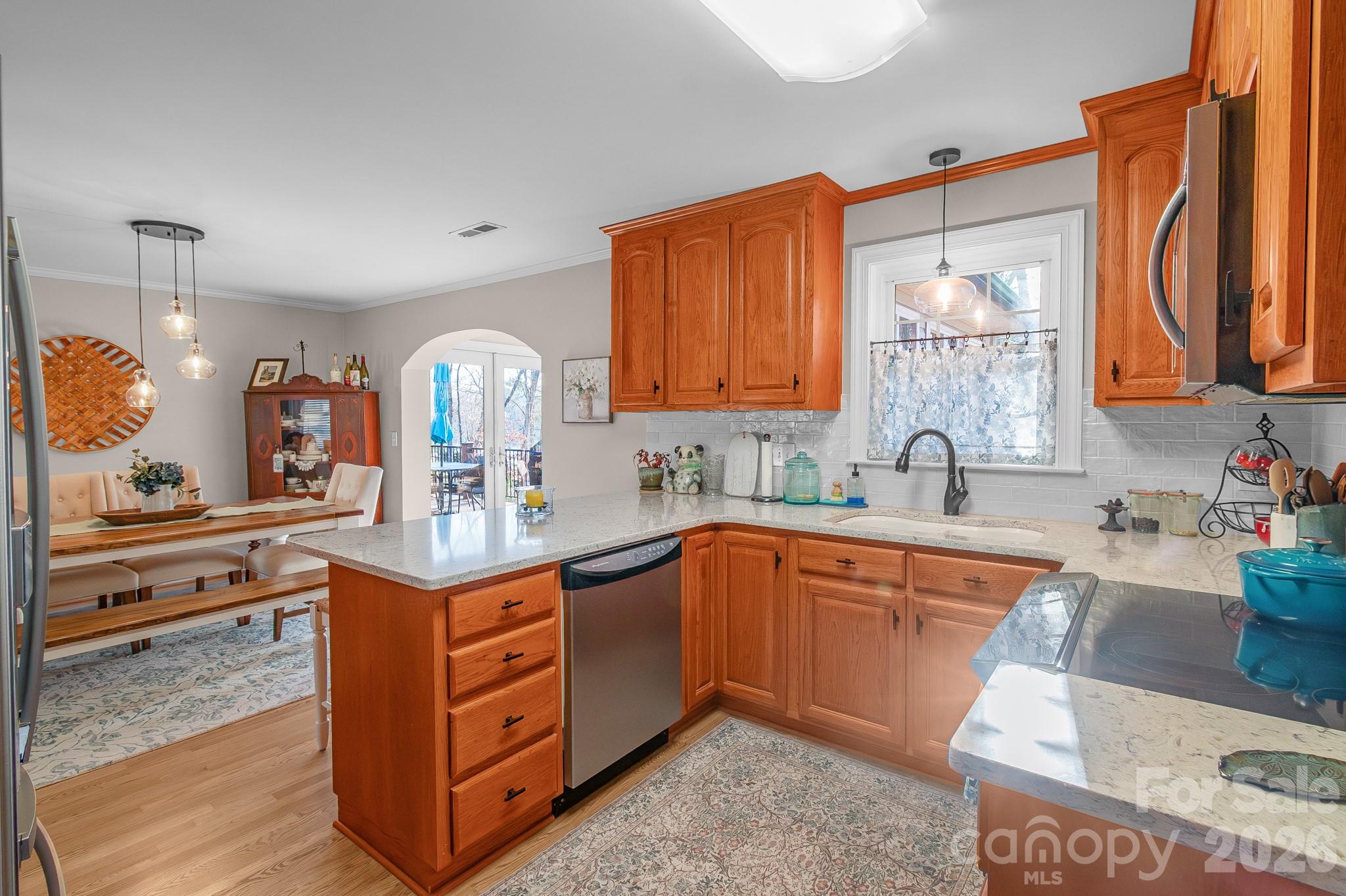 572 Acorn Acres Road Norwood, NC 28128 - Photo 27 of 39 a kitchen with stainless steel appliances granite countertop a sink stove and cabinets
