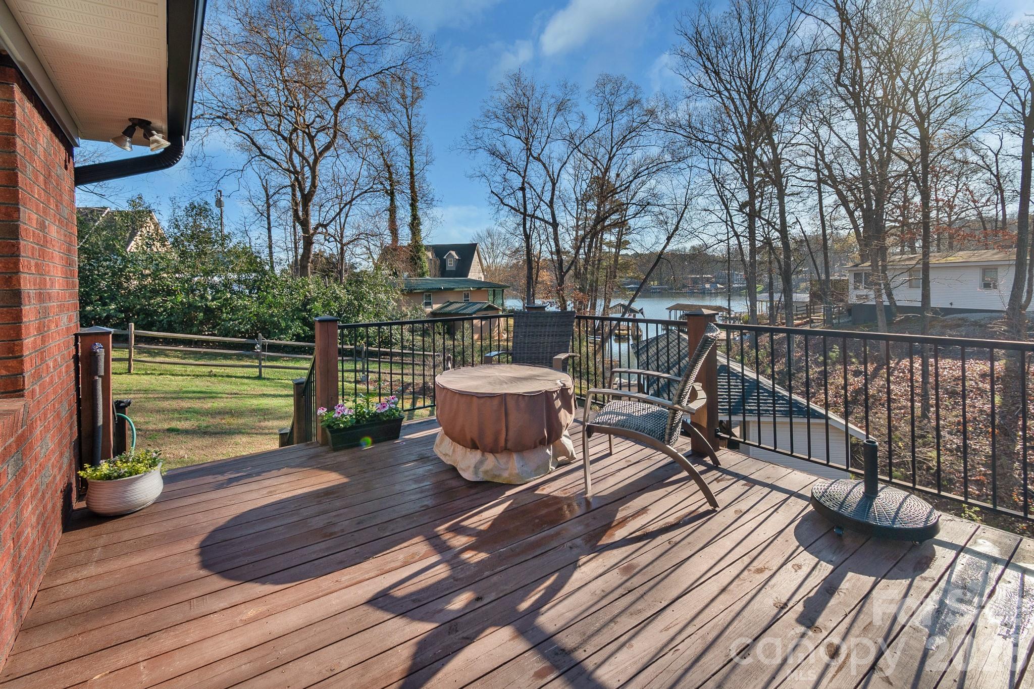 572 Acorn Acres Road Norwood, NC 28128 - Photo 30 of 39 a view of a deck with wooden floor and outdoor seating