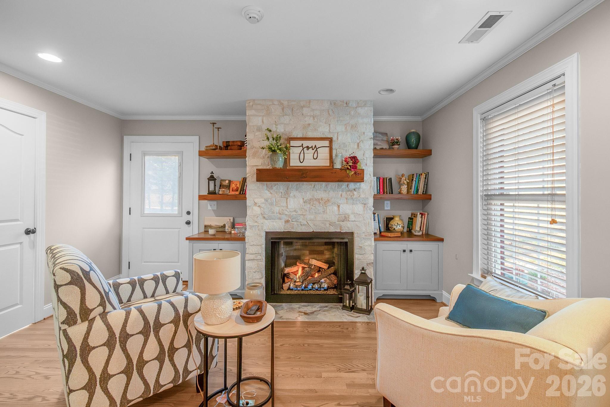 572 Acorn Acres Road Norwood, NC 28128 - Photo 3 of 39 a living room with furniture and a fireplace