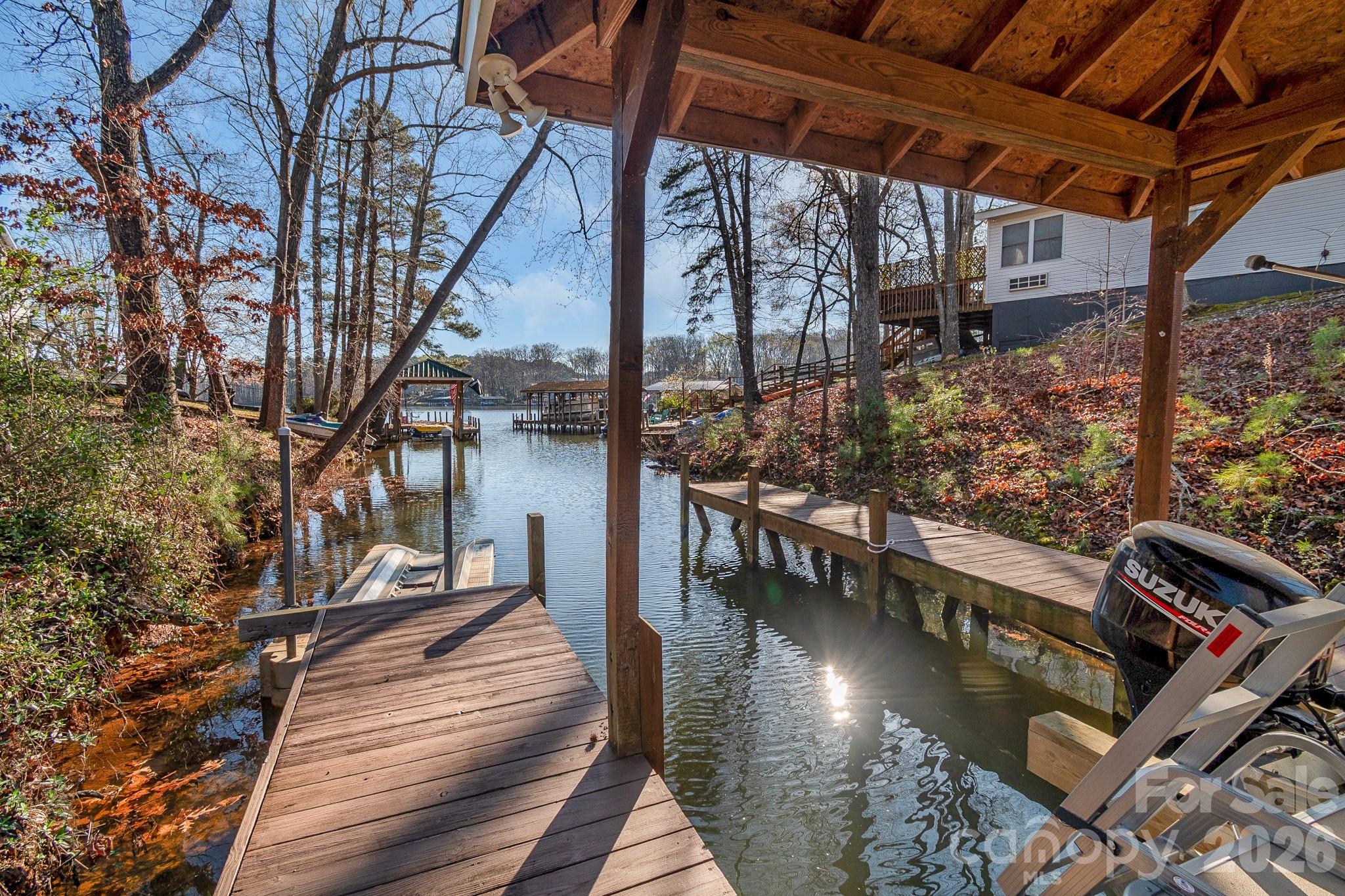 572 Acorn Acres Road Norwood, NC 28128 - Photo 33 of 39 a view of a chairs and tables on the roof deck