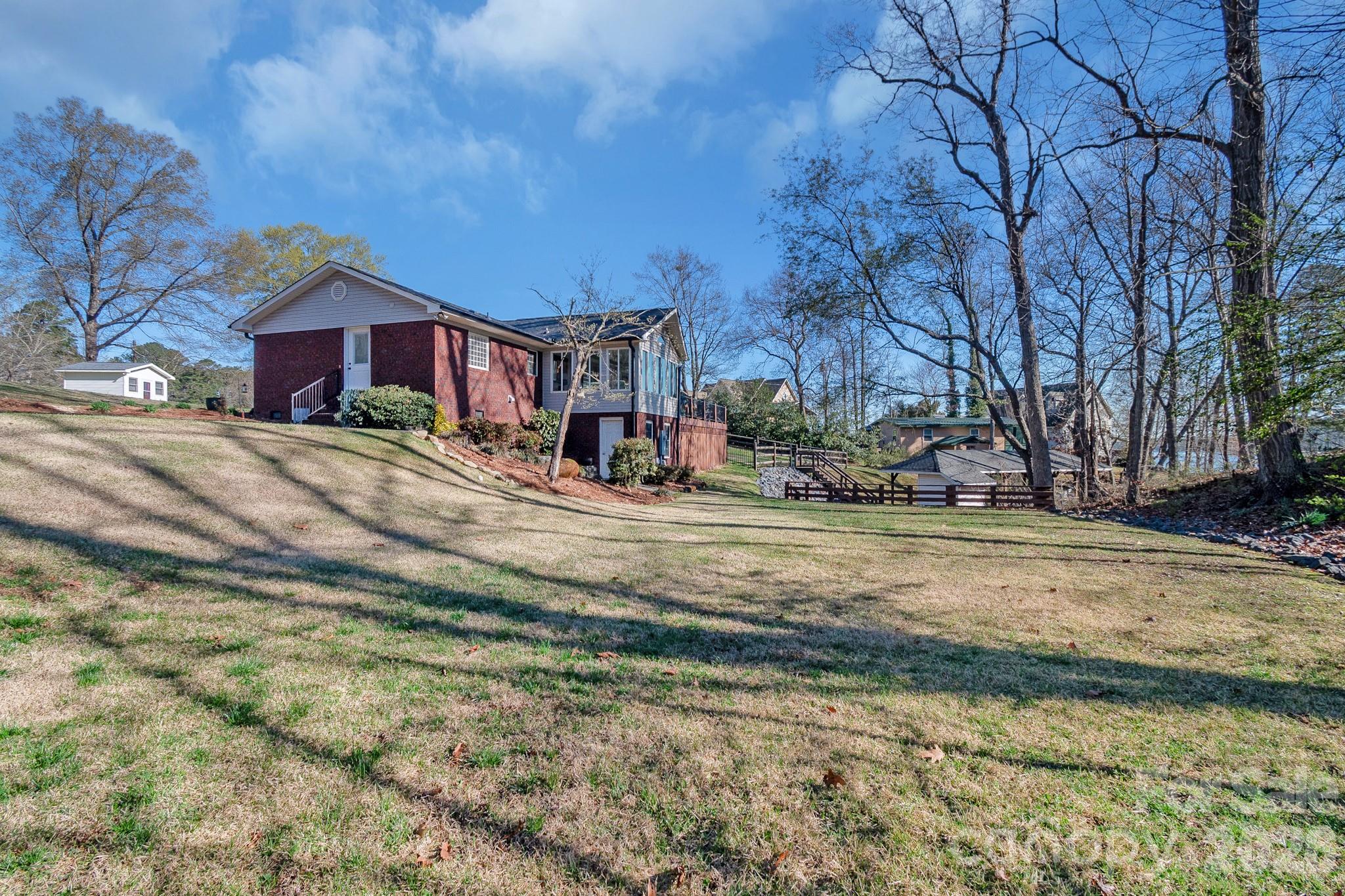 572 Acorn Acres Road Norwood, NC 28128 - Photo 35 of 39 a view of a house with a yard