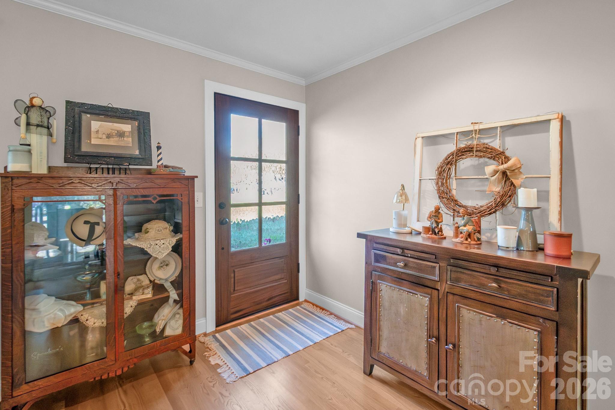 572 Acorn Acres Road Norwood, NC 28128 - Photo 7 of 39 a room with painting on the wall and a mirror