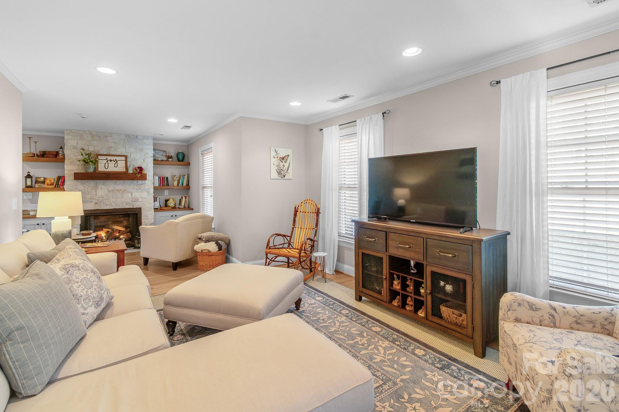 572 Acorn Acres Road Norwood, NC 28128 - Photo 8 of 39 a living room with furniture and a flat screen tv