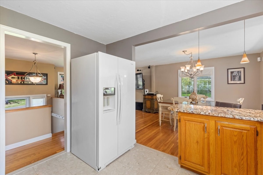30 South Cross Road Haverhill, MA 01835 - Photo 14 of 42 a very nice looking dining room with kitchen island furniture and a chandelier