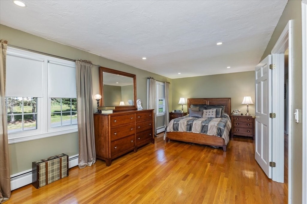 30 South Cross Road Haverhill, MA 01835 - Photo 17 of 42 a bedroom with a bed and large windows