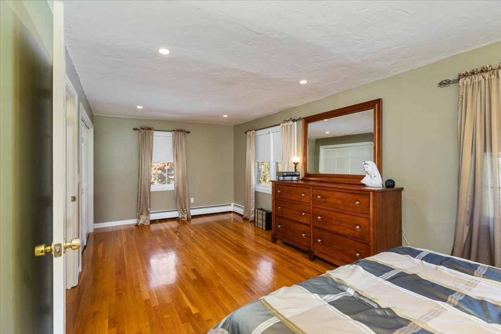 30 South Cross Road Haverhill, MA 01835 - Photo 18 of 42 a bedroom with a bed and a dresser