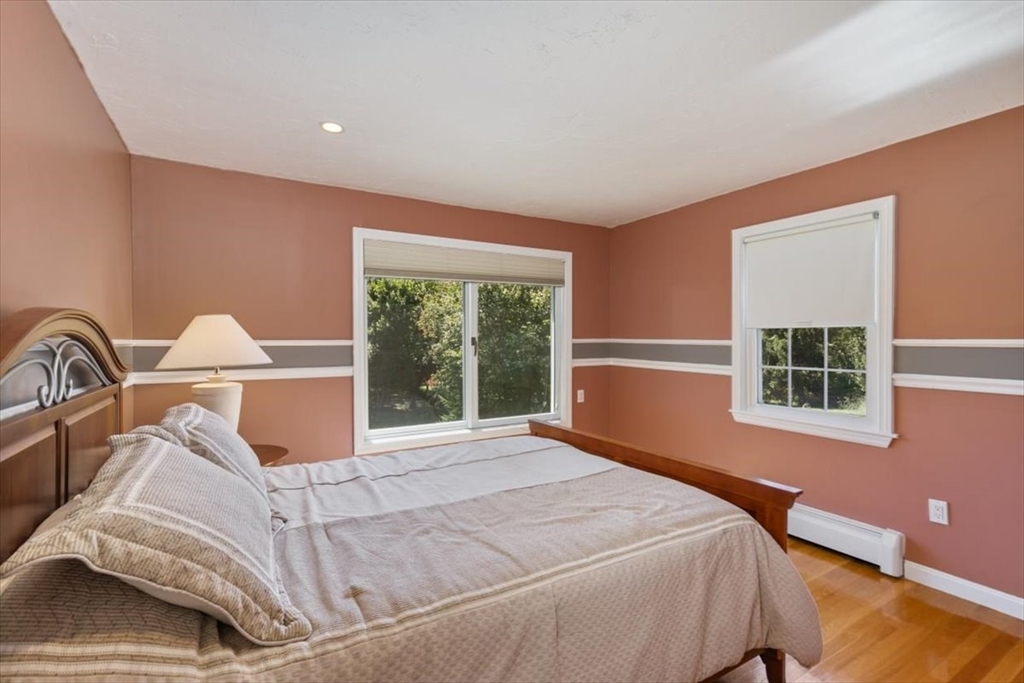 30 South Cross Road Haverhill, MA 01835 - Photo 20 of 42 a bed sitting in a bedroom next to a window