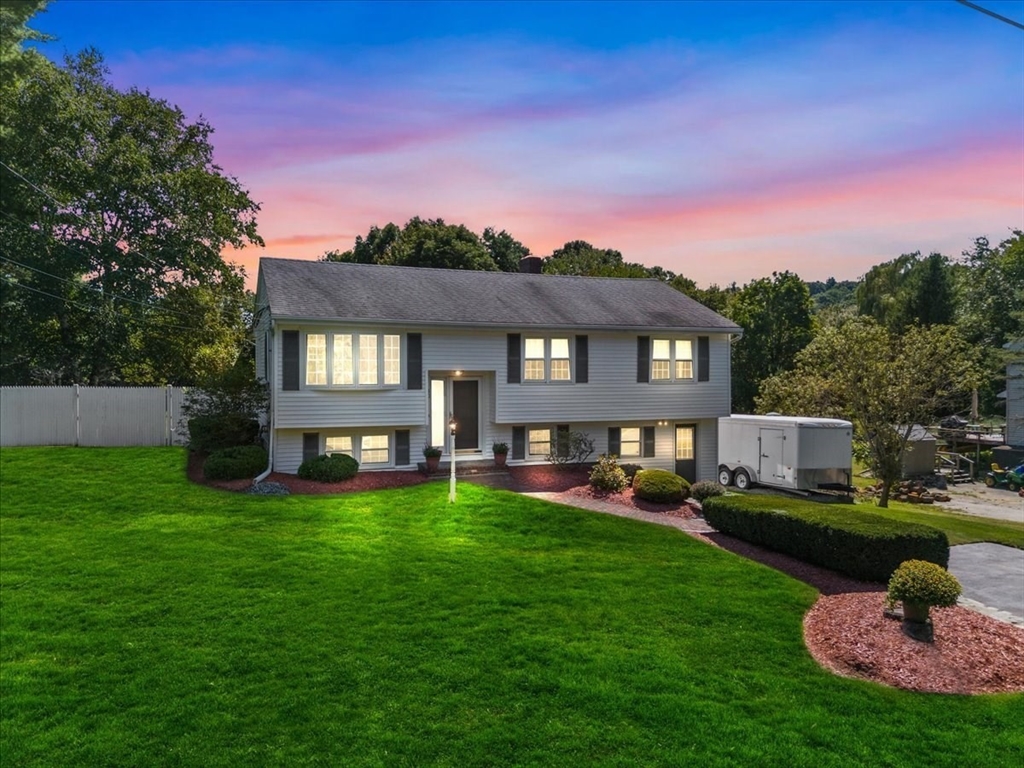 30 South Cross Road Haverhill, MA 01835 - Photo 2 of 42 a view of a house with a big yard potted plants and a large tree
