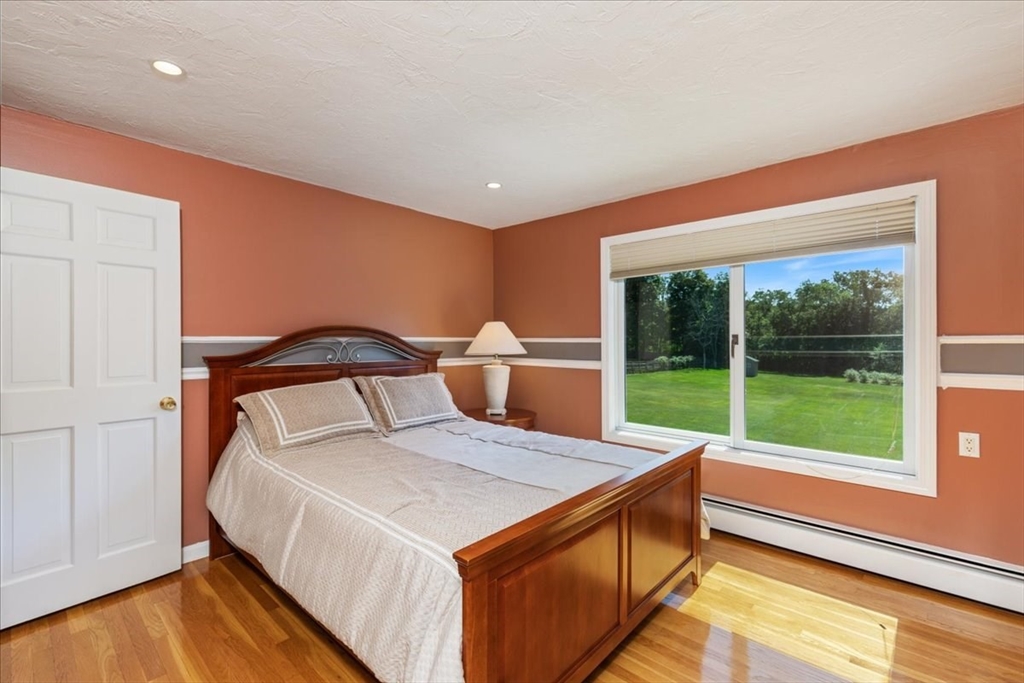 30 South Cross Road Haverhill, MA 01835 - Photo 21 of 42 a bed sitting in a room next to a window