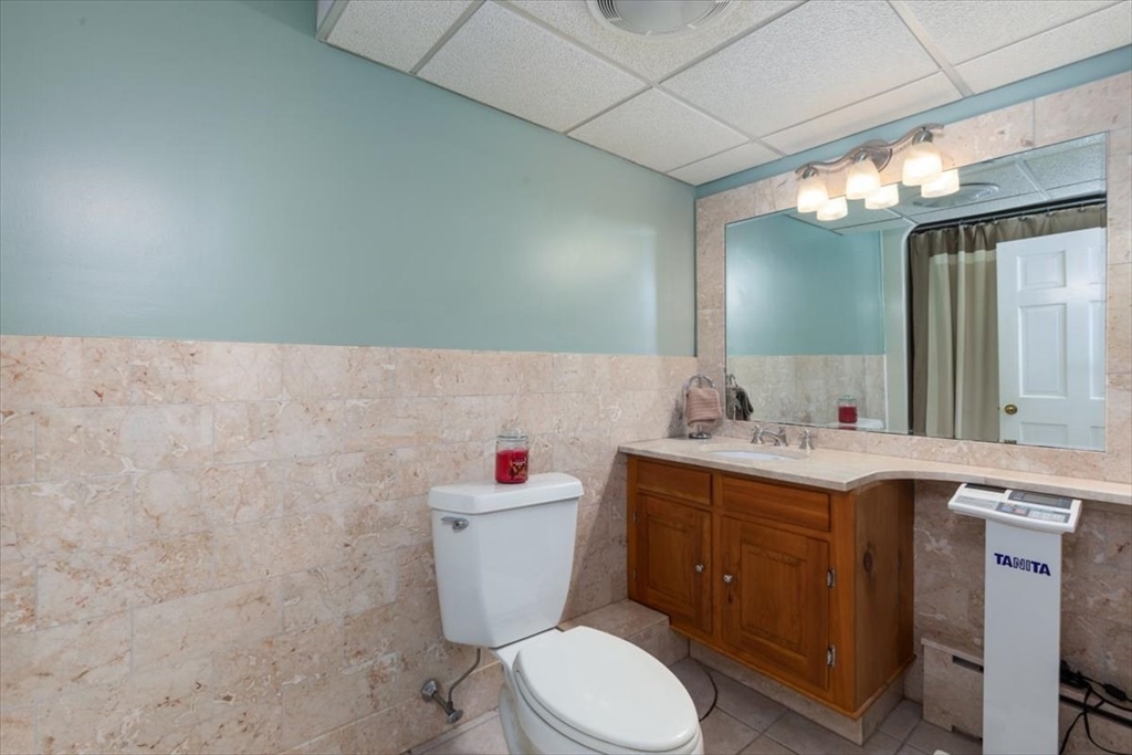 30 South Cross Road Haverhill, MA 01835 - Photo 25 of 42 a bathroom with a sink mirror vanity and toilet