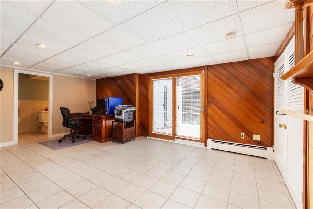 30 South Cross Road Haverhill, MA 01835 - Photo 28 of 42 a living room with furniture a flat screen tv and a window