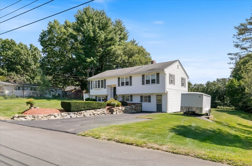 30 South Cross Road Haverhill, MA 01835 - Photo 3 of 42 a front view of a house with a yard table and chairs