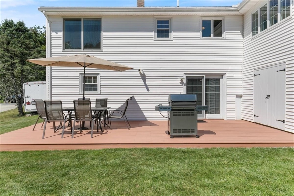 30 South Cross Road Haverhill, MA 01835 - Photo 38 of 42 a view of a backyard with table and chairs