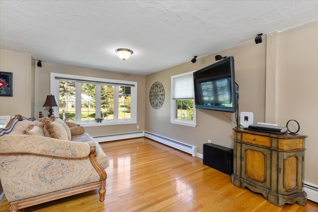 30 South Cross Road Haverhill, MA 01835 - Photo 6 of 42 a living room with furniture and a flat screen tv