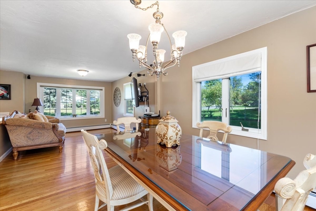 30 South Cross Road Haverhill, MA 01835 - Photo 9 of 42 a view of a dining room with furniture a chandelier and wooden floor