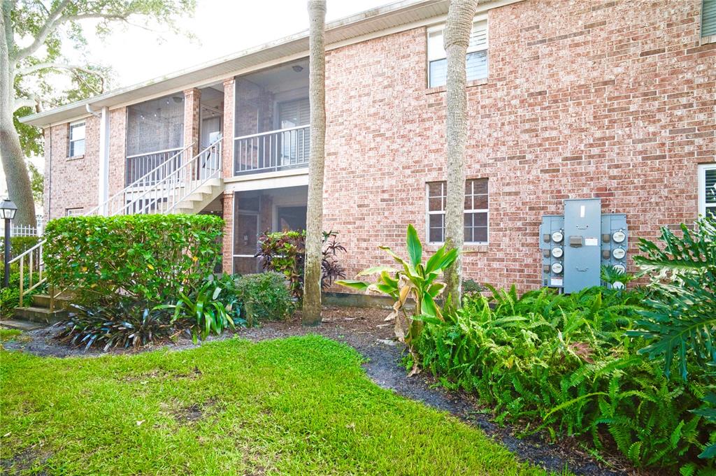 4212 Lake Underhill Road, Unit 5D9 Orlando, FL 32803 - Photo 34 of 58 front view of a house with a garden