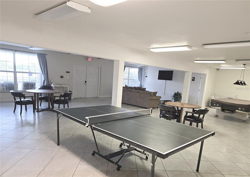 4212 Lake Underhill Road, Unit 5D9 Orlando, FL 32803 - Photo 45 of 58 a room with table chairs and windows