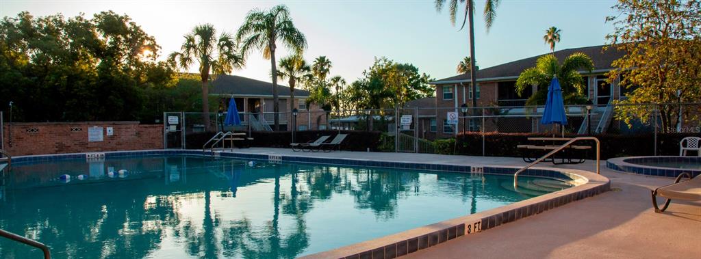 4212 Lake Underhill Road, Unit 5D9 Orlando, FL 32803 - Photo 49 of 58 a view of swimming pool with chairs