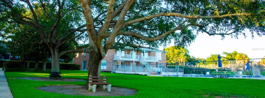 4212 Lake Underhill Road, Unit 5D9 Orlando, FL 32803 - Photo 51 of 58 a front view of a house with a yard