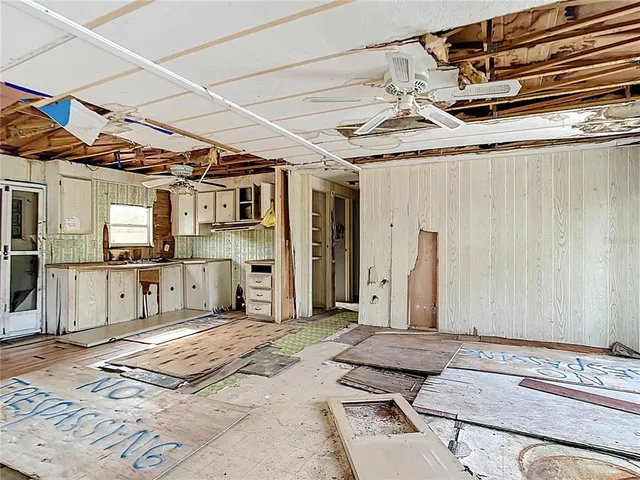 a bedroom with a bed and a mirror