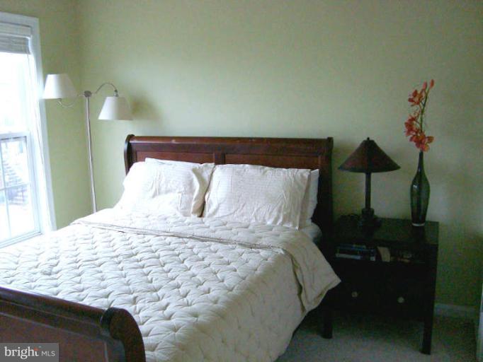 9137 Furey Road Lorton, VA 22079 - Photo 12 of 21 Guest bedroom with vaulted ceilings
