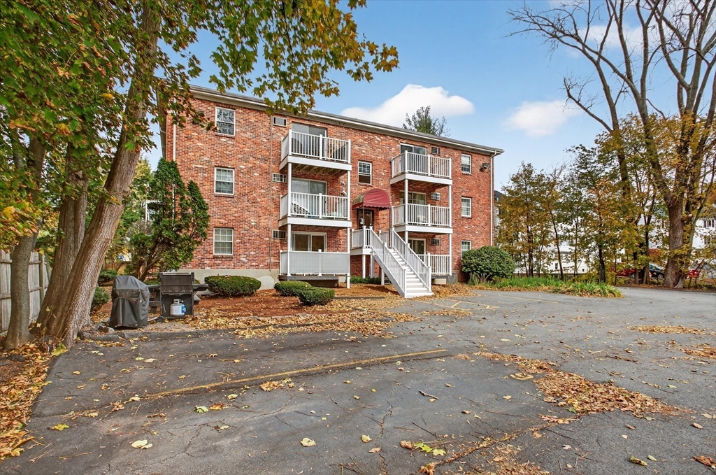 38 Bennett Street, Unit 3D Wakefield, MA 01880 - Photo 19 of 22 a view of a house with a yard