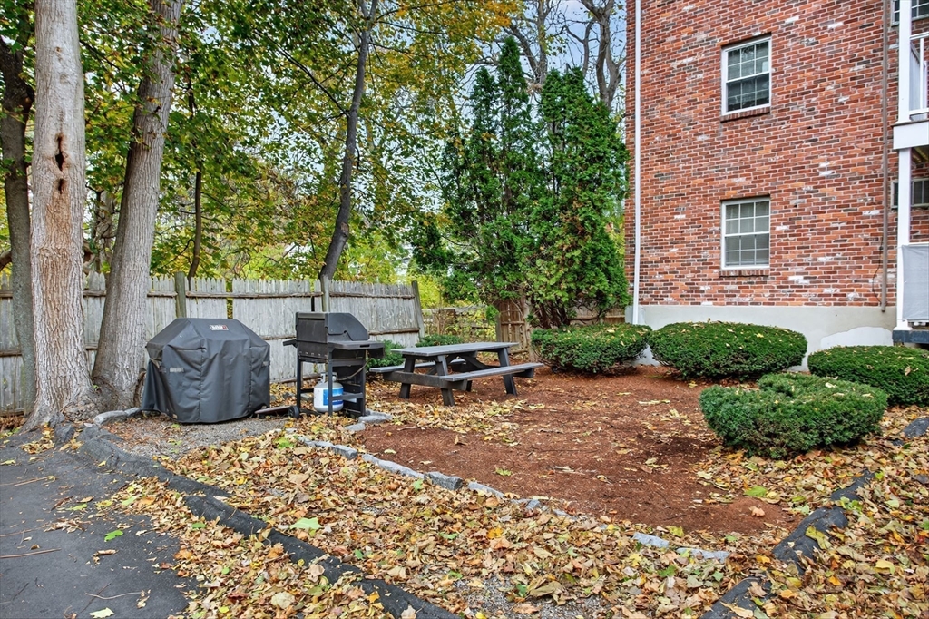 38 Bennett Street, Unit 3D Wakefield, MA 01880 - Photo 20 of 22 a view of a patio with table and chairs and potted plants