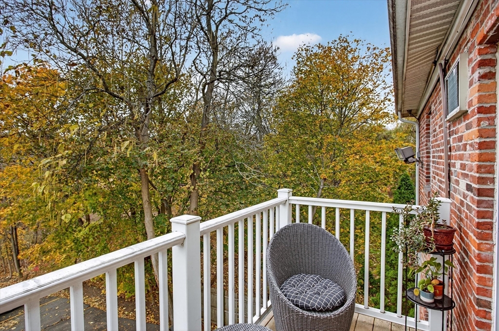38 Bennett Street, Unit 3D Wakefield, MA 01880 - Photo 7 of 22 a view of roof deck with chairs and wooden fence