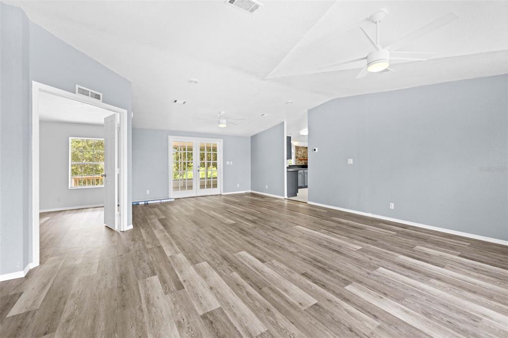33320 Larkin Road Dade City, FL 33523 - Photo 13 of 60 wooden floor in an empty room with a window