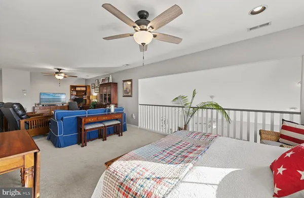 a bedroom with a bed and a couch