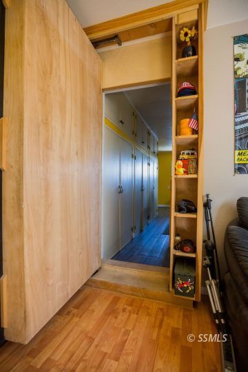 246 Peg Street Ridgecrest, CA 93555 - Photo 21 of 30 a view of an empty room with wooden floor and windows
